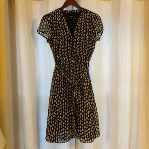Cap sleeve fit and flare dress with pin tuck detail and sash. Size 6